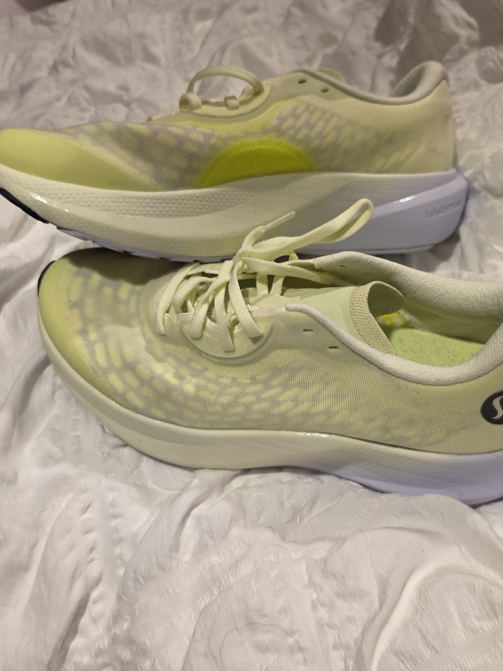Lululemon yellow athletic running shoes.